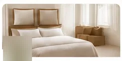 Freshly made bed in a clean bedroom